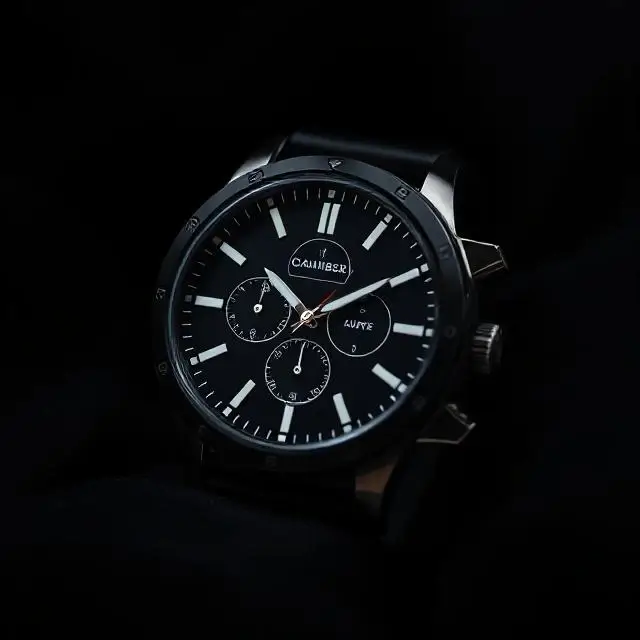 A sleek product shot of a watch taken in the Blackout Chamber.